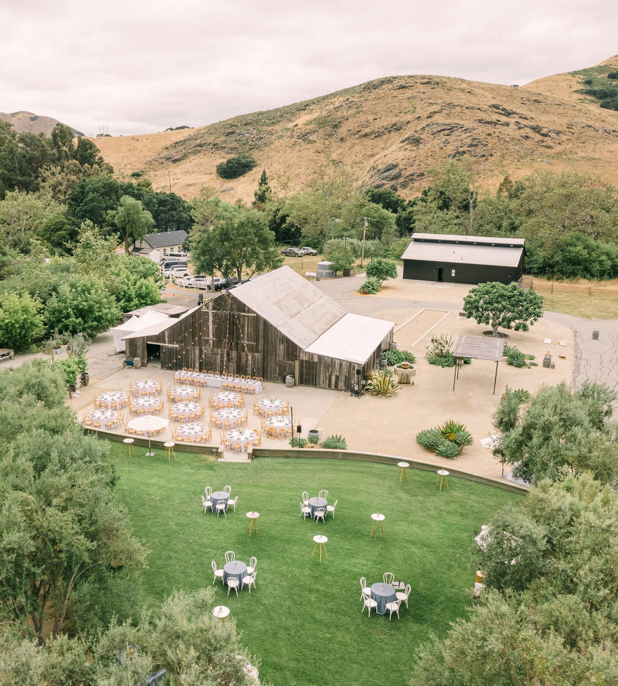 Overview of reception area and cocktail hour at san luis obispo luxury ranch wedding at higuera ranch photographed by Jessica Sofranko
